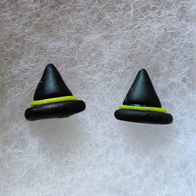 Load image into Gallery viewer, A close up picture of a pair of black witches hats with yellow bands made into flat backed stud earrings.