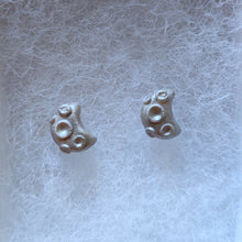 Load image into Gallery viewer, A close up picture of a pair of silver metallic crescent moons with 3D craters on the surface.